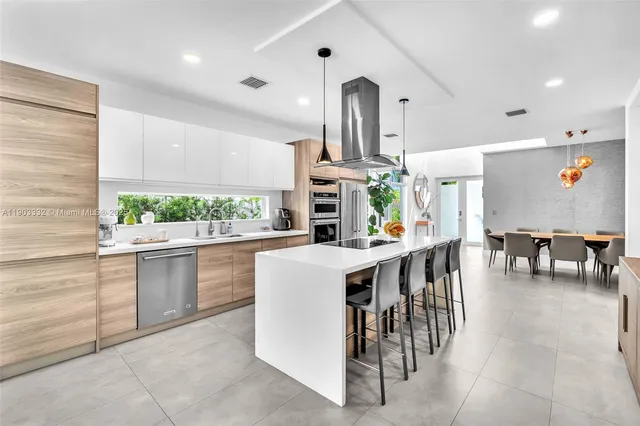 a kitchen with a sink and stove