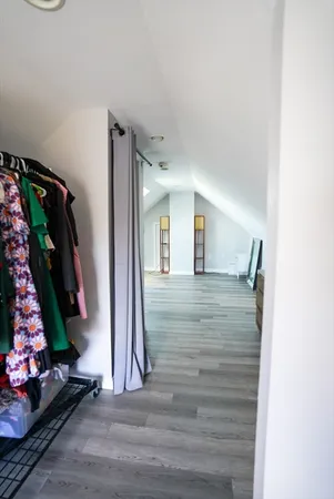a view of an entryway with wooden floor
