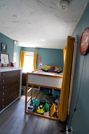 a bedroom with bunk bed and a dresser