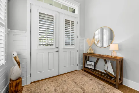 a view of an entryway with wooden floor