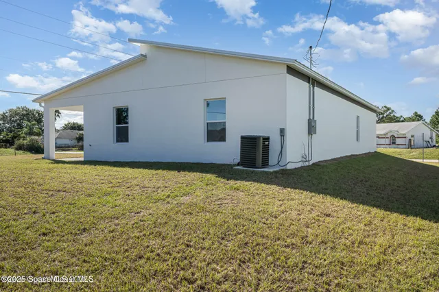 a house view with a backyard space