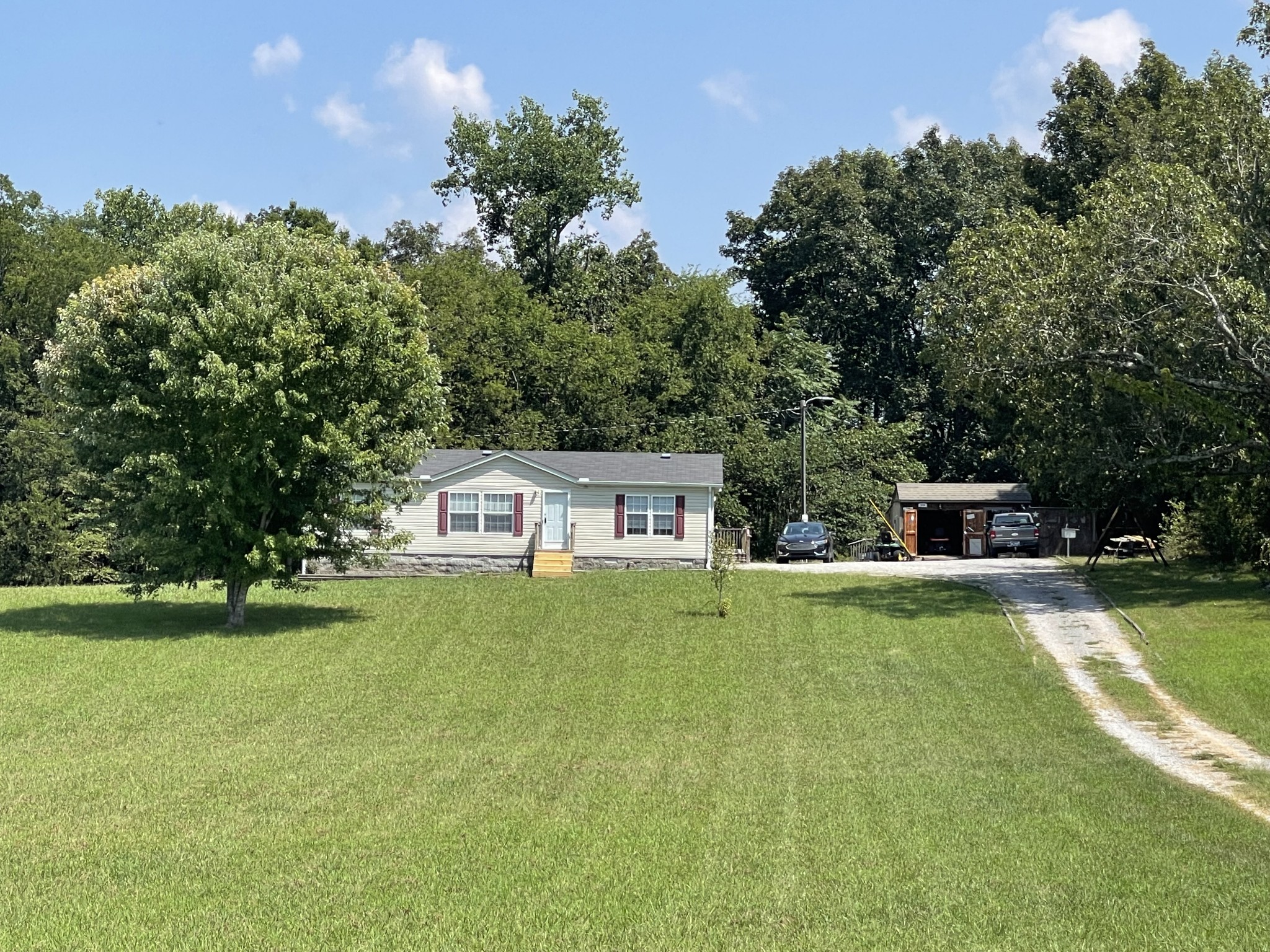 3556 Goshen Road Santa Fe, TN 38482 - Photo 1 of 22 a front view of a house with a yard