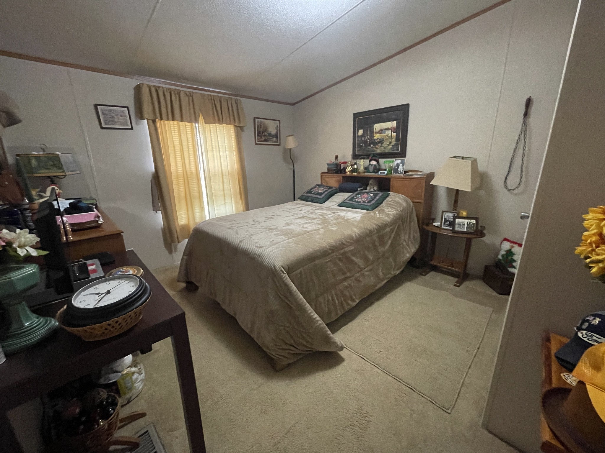 3556 Goshen Road Santa Fe, TN 38482 - Photo 14 of 22 a bedroom with a bed and a dresser next to a window
