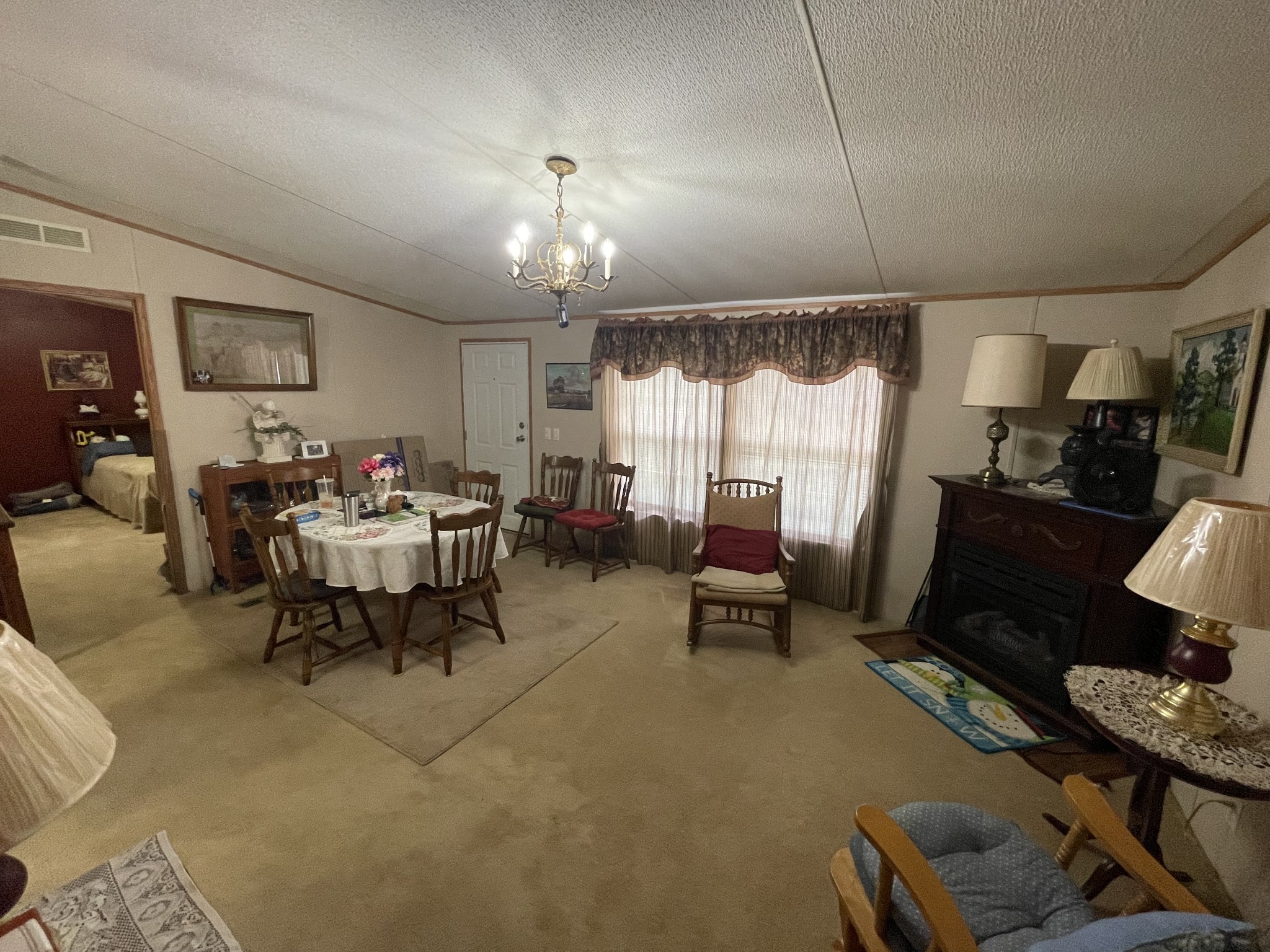 3556 Goshen Road Santa Fe, TN 38482 - Photo 6 of 22 a living room with furniture and a chandelier