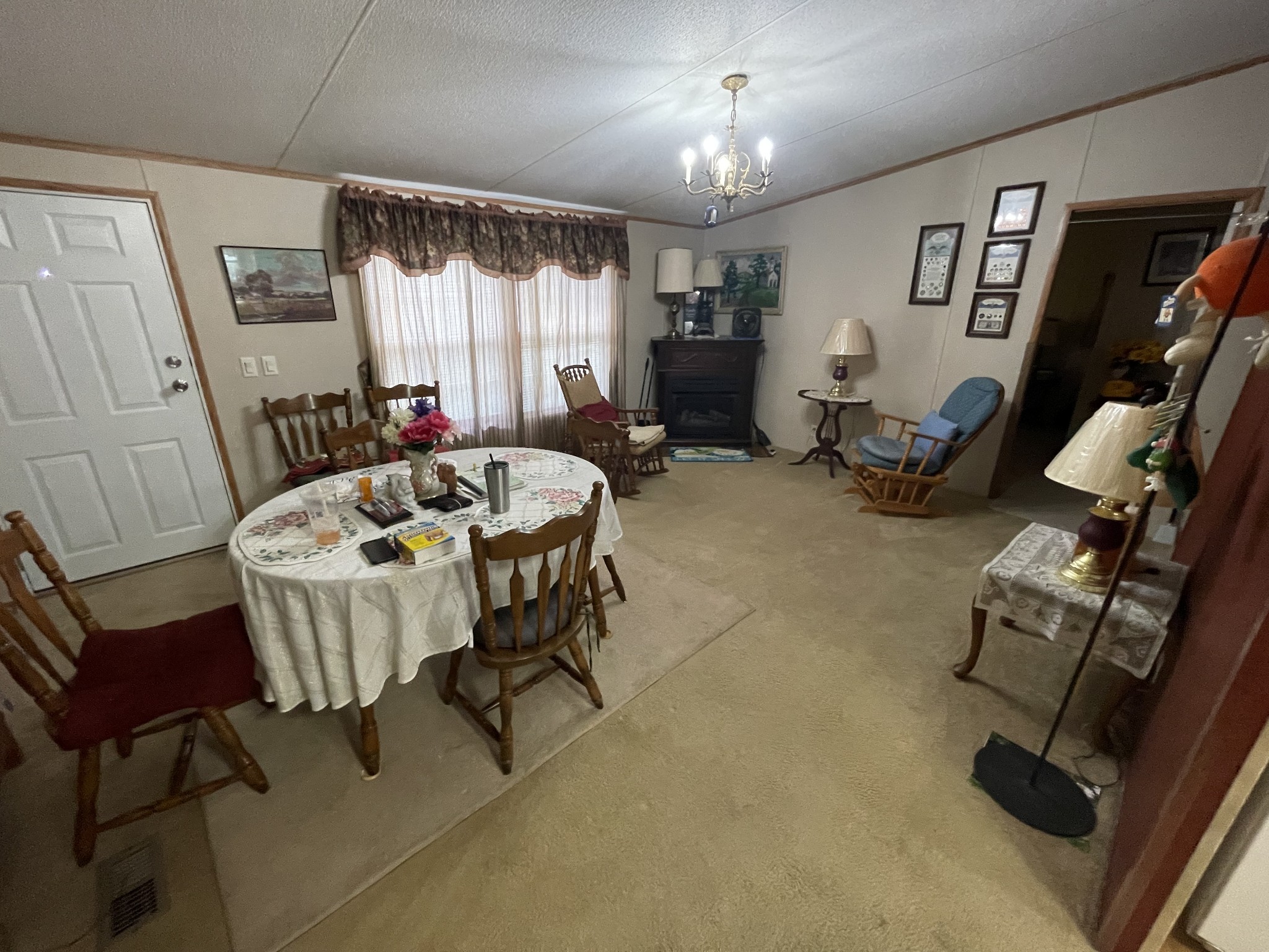 3556 Goshen Road Santa Fe, TN 38482 - Photo 7 of 22 a living room with furniture a chandelier and a window