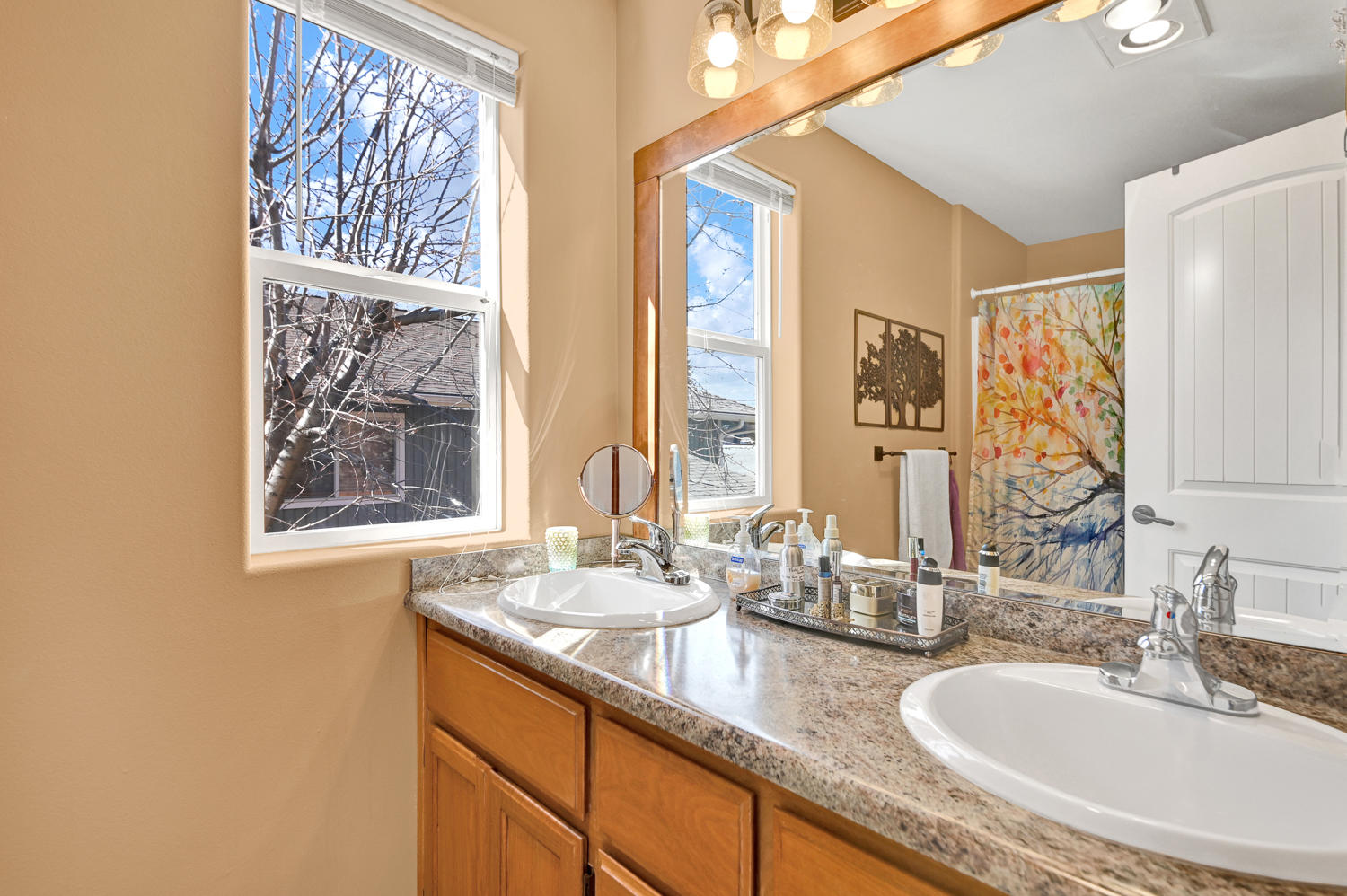 1142 Northeast Ross Road Bend, OR 97701 - Photo 13 of 30 Beautifully updated bath with double sinks, new counters, new flooring.