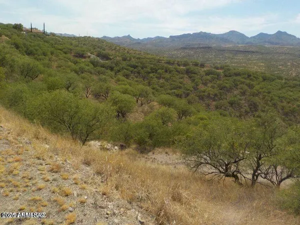 a view of a mountain with a outdoor space