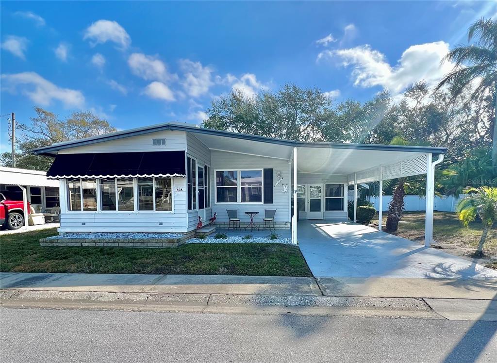 1100 South Belcher Road, Unit 706 Largo, FL 33771 - Photo 1 of 1 front view of a house with a yard
