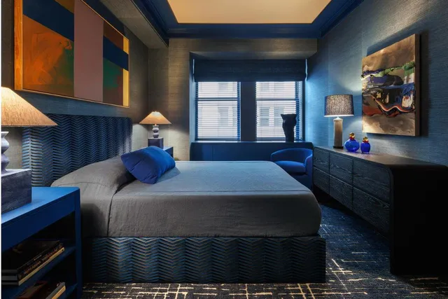 a living room with couches a coffee table and appliance view