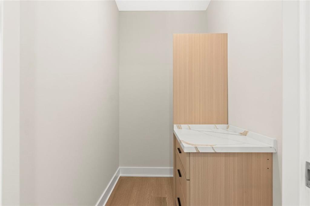 7066 Bells Way Fairburn, GA 30213 - Photo 50 of 64 a bathroom with a sink and vanity