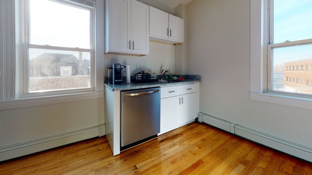 9 Winship Street, Unit 3 Boston, MA 02135 - Photo 3 of 10 a room with window and wooden floor