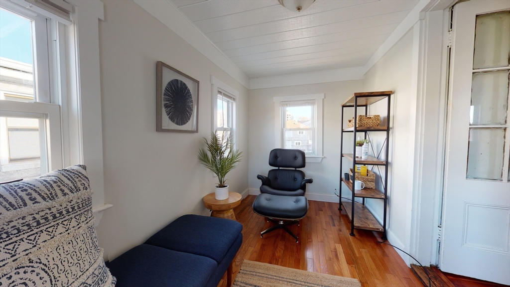 9 Winship Street, Unit 3 Boston, MA 02135 - Photo 6 of 10 a living room with furniture and a wooden floor
