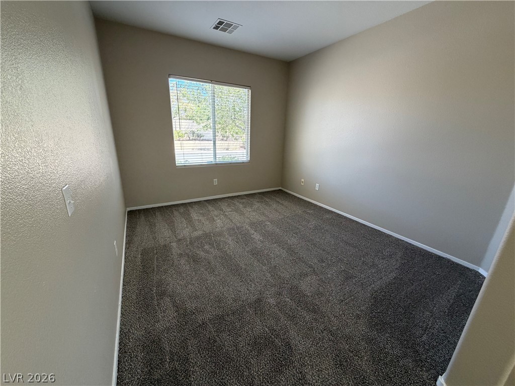 10975 Pumpkin Ridge Avenue Las Vegas, NV 89135 - Photo 11 of 13 A well-lit room with fresh carpeting awaits your personal touch.