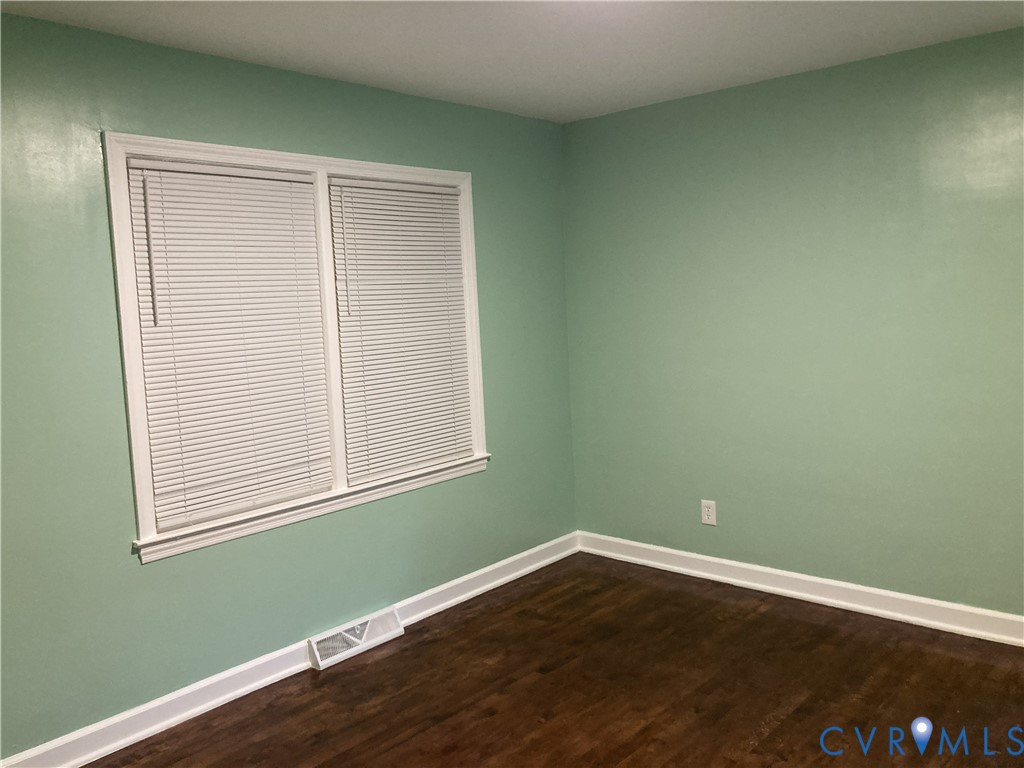 3003 Burge Street Hopewell, VA 23860 - Photo 14 of 30 an empty room with wooden floor and a window