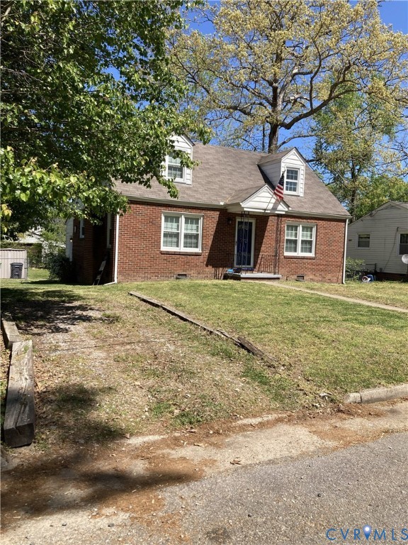 3003 Burge Street Hopewell, VA 23860 - Photo 2 of 30 a front view of a house with a garden