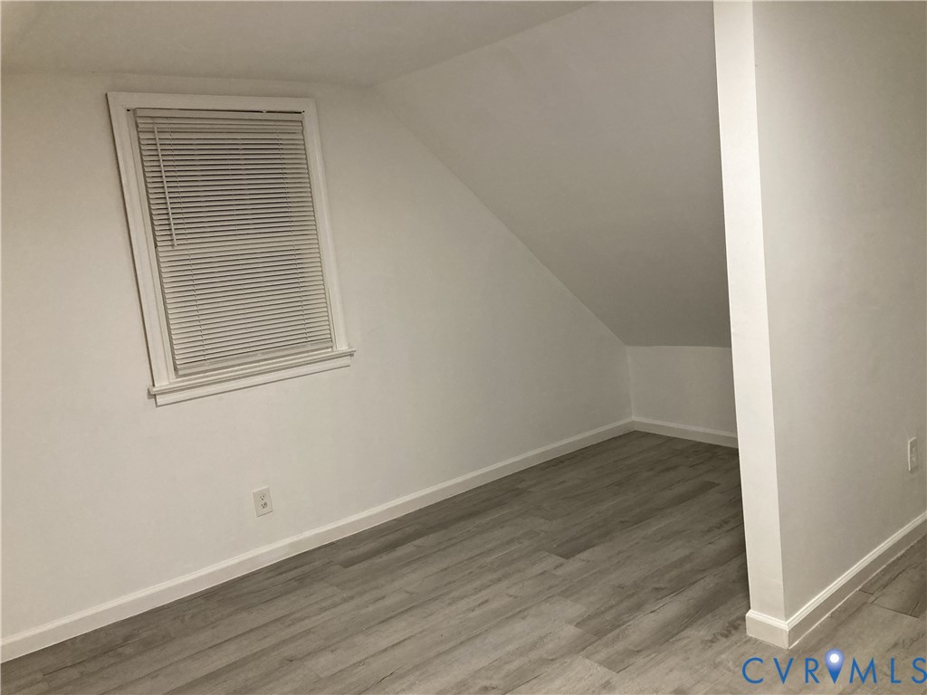 3003 Burge Street Hopewell, VA 23860 - Photo 23 of 30 an empty room with wooden floor and windows