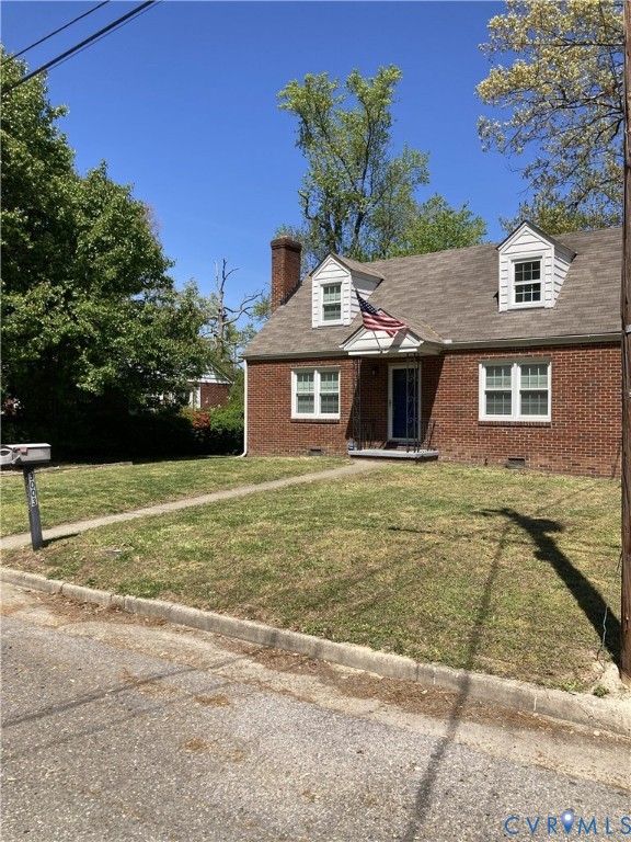3003 Burge Street Hopewell, VA 23860 - Photo 3 of 30 a front view of a house with a garden