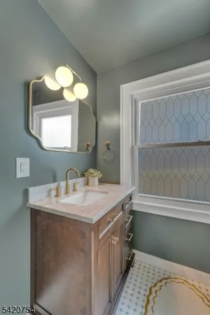 a bathroom with a sink and a mirror