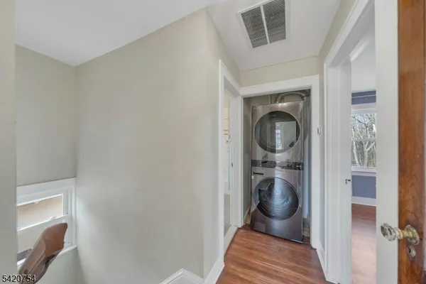 a view of a hallway with washer and dryer