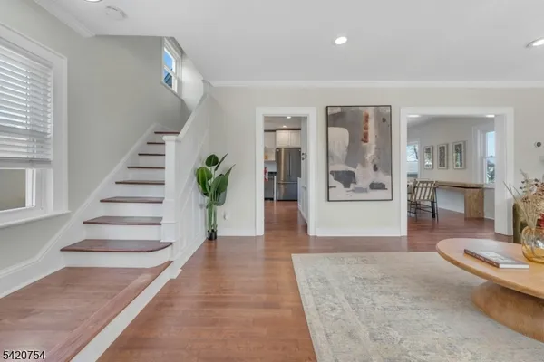 a view of a living room and entryway