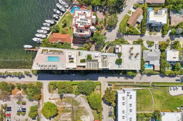 a view of swimming pool with outdoor seating and yard in back
