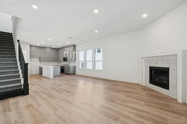 a view of a kitchen with a sink and a fireplace