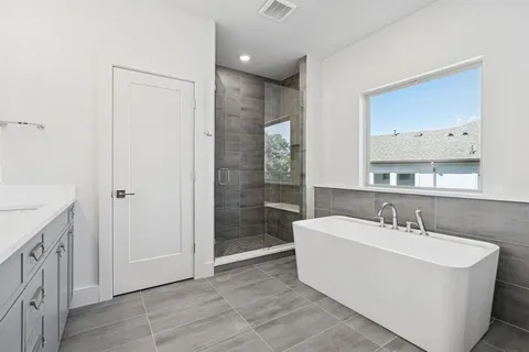 a bathroom with a sink a mirror and a shower