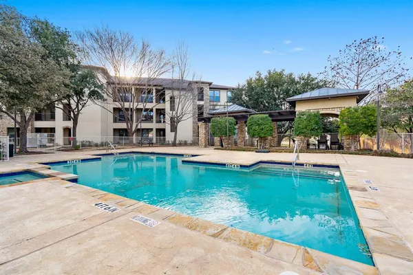 swimming pool view with a outdoor seating