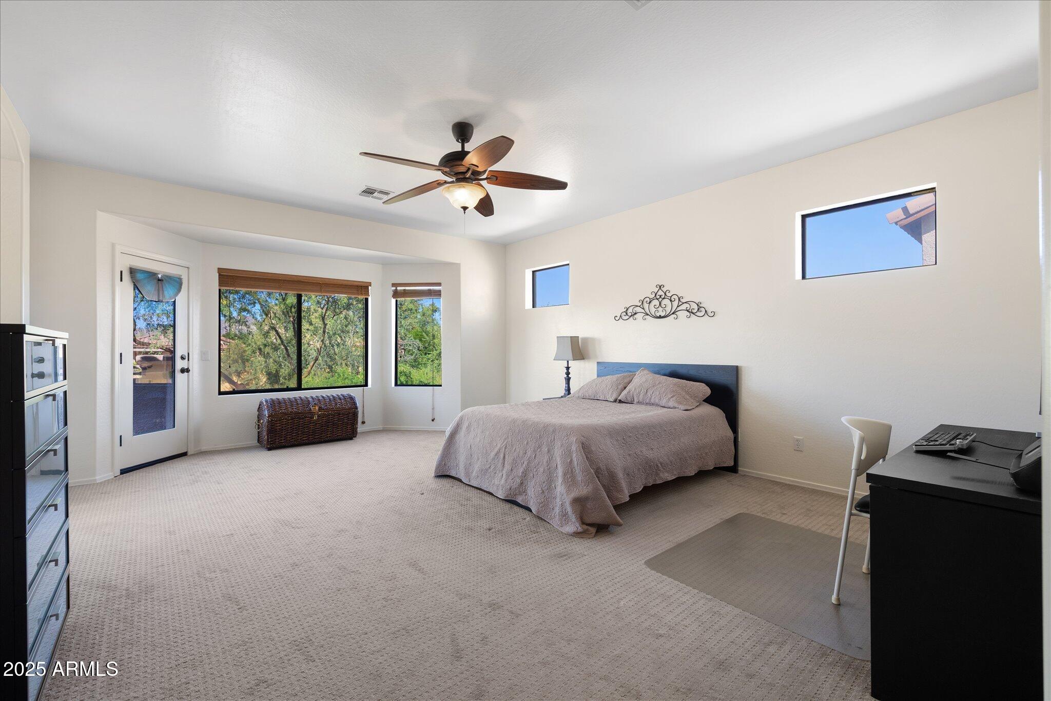 8536 East Inca Street Mesa, AZ 85207 - Photo 18 of 44 a spacious bedroom with a large bed and a window