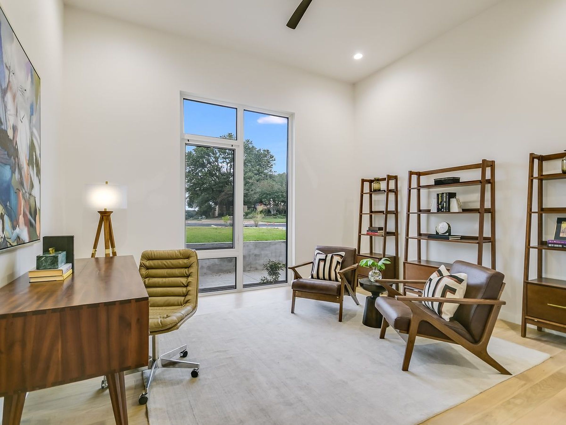 2476 Waymaker Way Austin, TX 78746 - Photo 10 of 31 Bright study with towering windows offers a peaceful workspace.