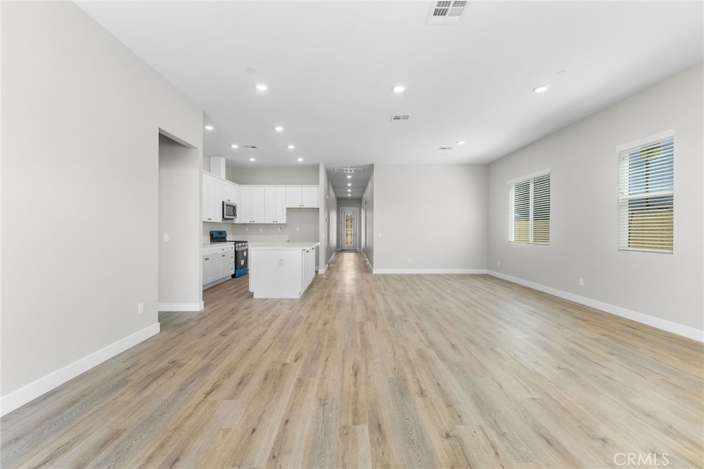 1341 East 8th Street Beaumont, CA 92223 - Photo 20 of 38 a view of a kitchen with wooden floor and a kitchen