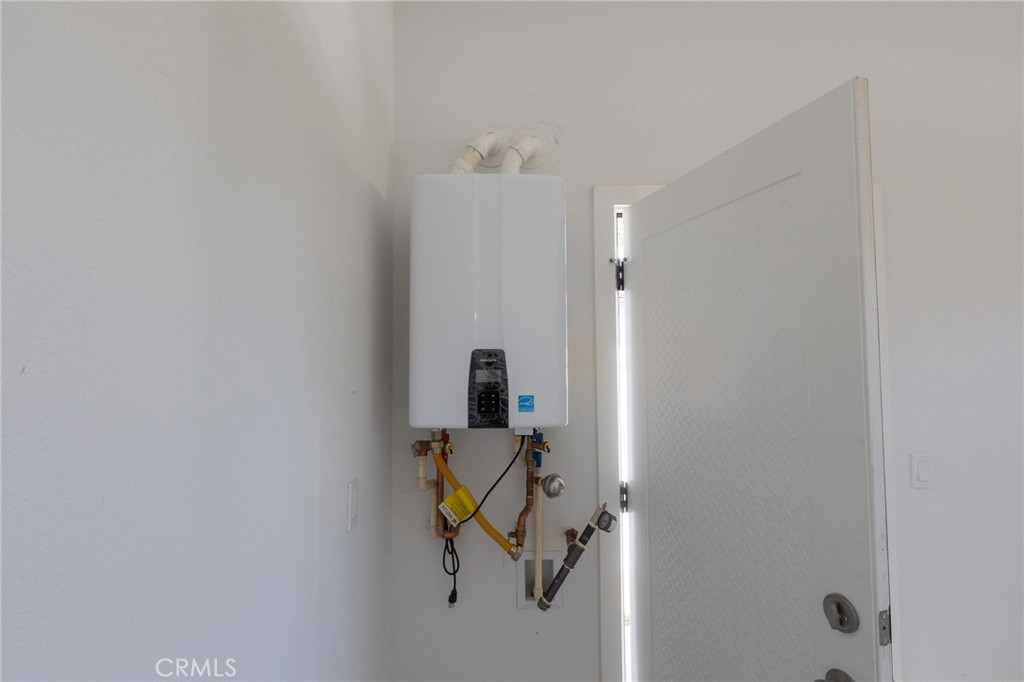 1341 East 8th Street Beaumont, CA 92223 - Photo 37 of 38 a bathroom with a shower and mirror