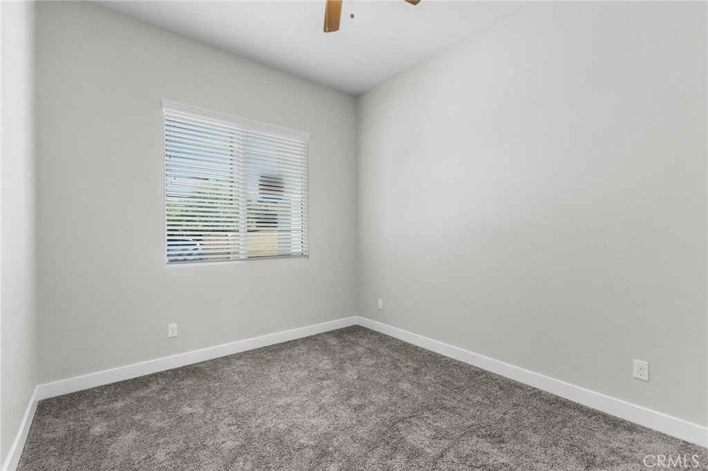 1341 East 8th Street Beaumont, CA 92223 - Photo 8 of 38 an empty room with a window