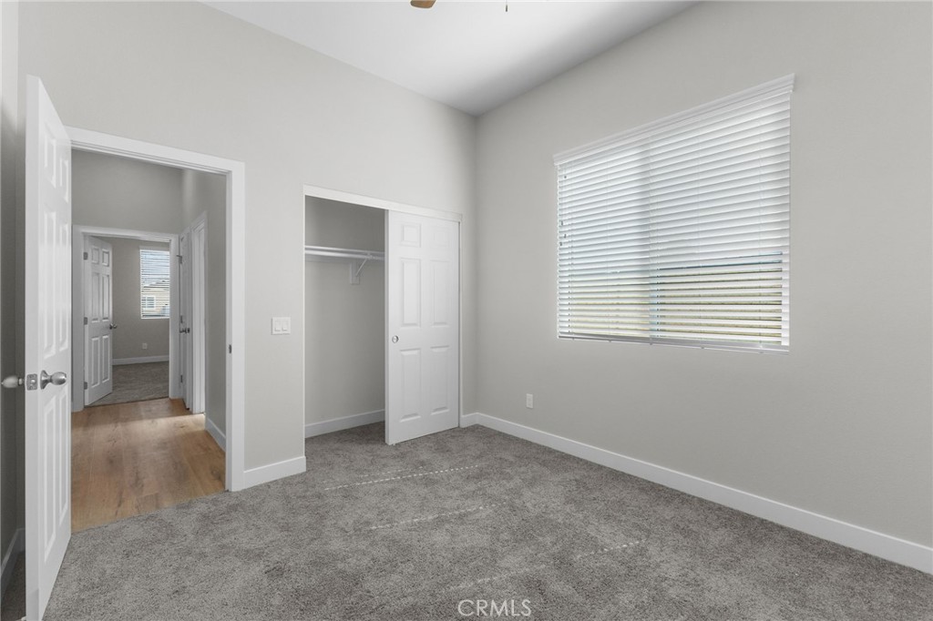 1341 East 8th Street Beaumont, CA 92223 - Photo 10 of 38 an empty room that has a window