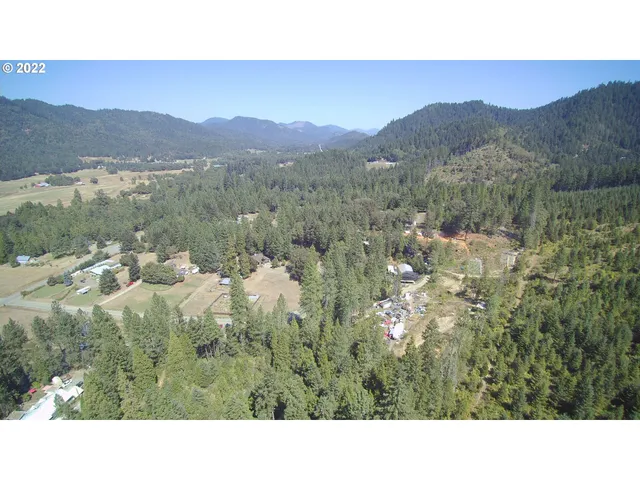 a open area with mountains in the background