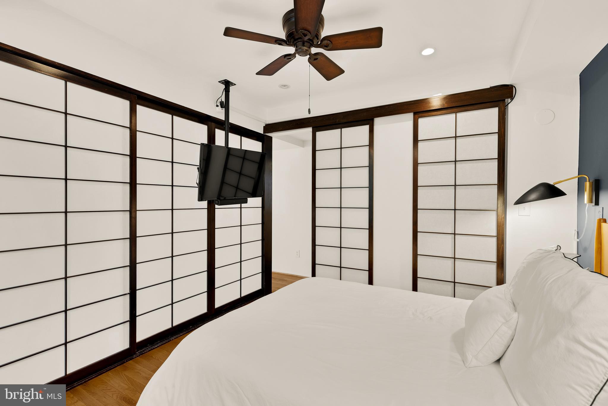 2370 Champlain Street Northwest, Unit 21 Washington, DC 20009 - Photo 14 of 22 a bedroom with a bed and a large window