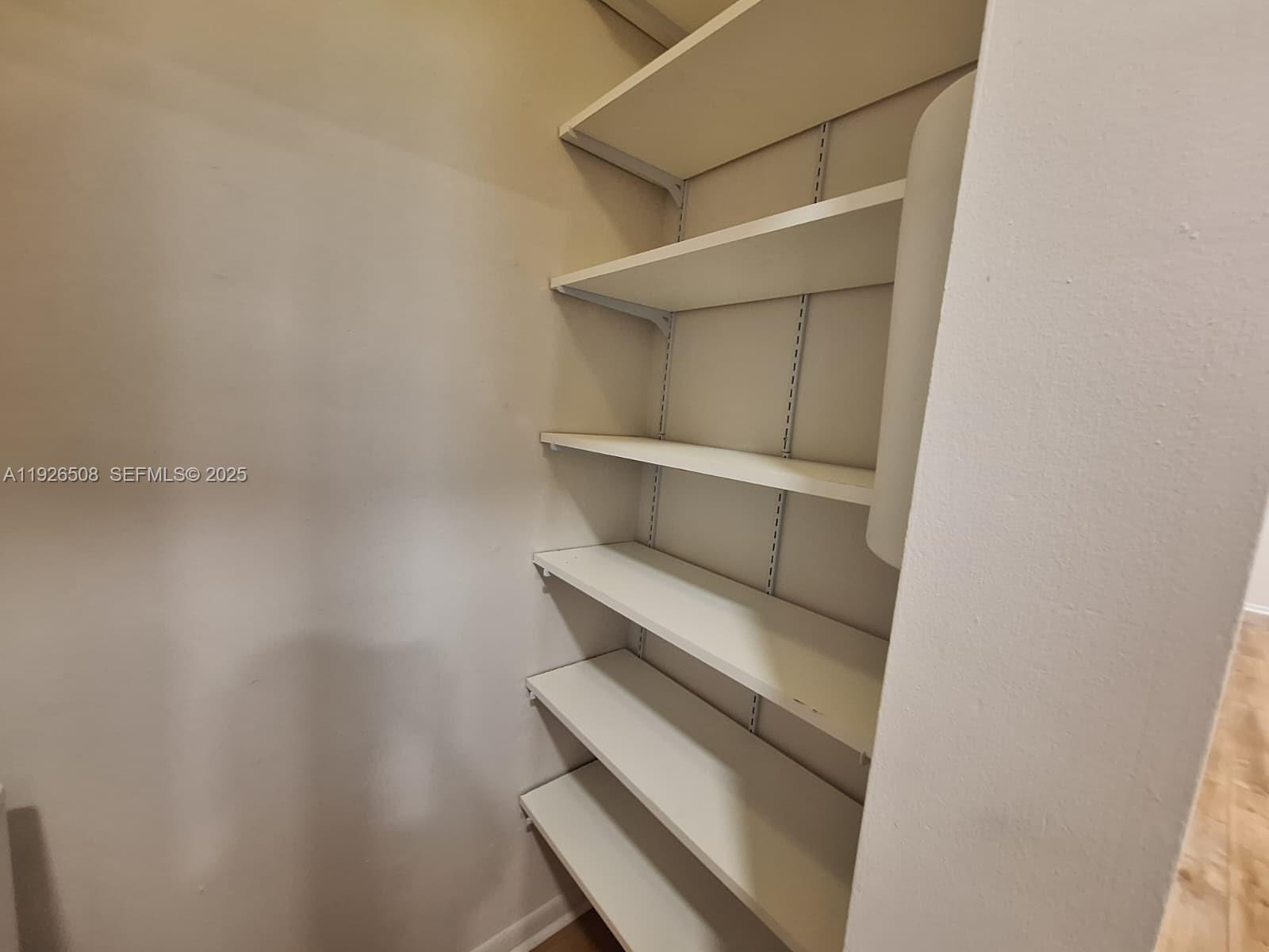 22295 Timberly Drive, Unit 22295 Boca Raton, FL 33428 - Photo 11 of 68 a view of room with racks on the wall