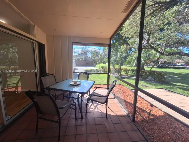 a view of swimming pool with seating area