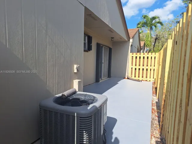 a view of a house with a yard and garage