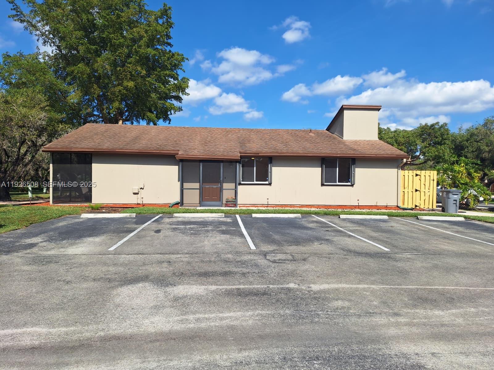 22295 Timberly Drive, Unit 22295 Boca Raton, FL 33428 - Photo 38 of 68 a house view with a garden space