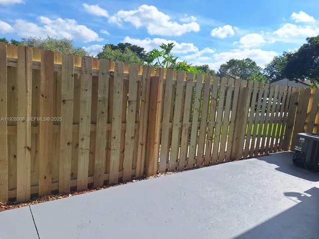 an aerial view of a house with a lake view