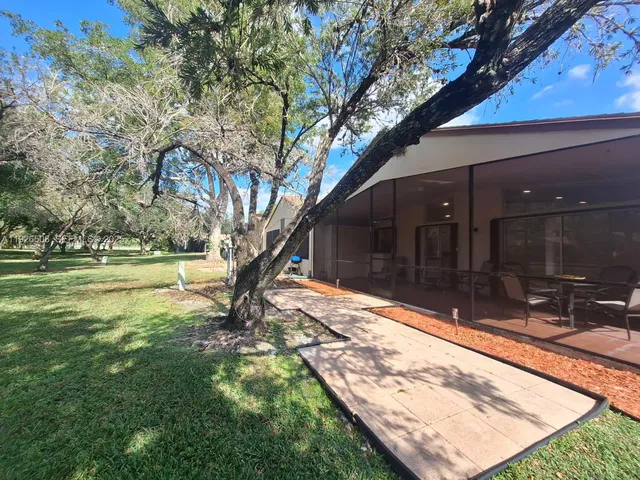 a view of swimming pool with a yard
