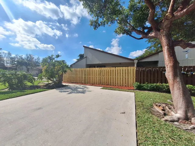 a backyard of a house with lots of green space