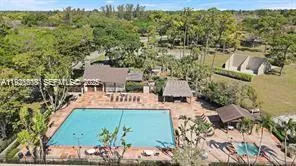 a backyard of a house with a yard and outdoor seating