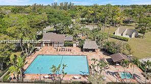 22295 Timberly Drive, Unit 22295 Boca Raton, FL 33428 - Photo 50 of 68 an aerial view of a house with a lake view