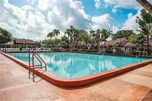 22295 Timberly Drive, Unit 22295 Boca Raton, FL 33428 - Photo 56 of 68 a view of swimming pool with a yard