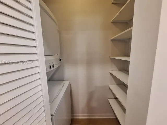 a view of a patio with a table chairs and a backyard