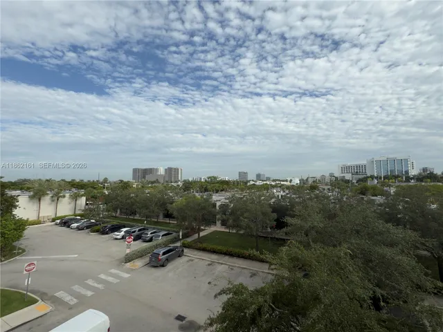 a view of a swimming pool with outdoor seating