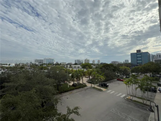 a view of a swimming pool with chairs in patio