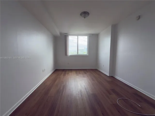 a bathroom with a double vanity sink toilet mirror and shower